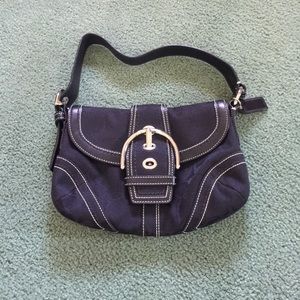 Black coach purse.