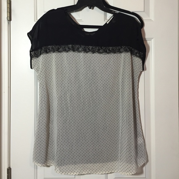 Black and white polka dot shirt.