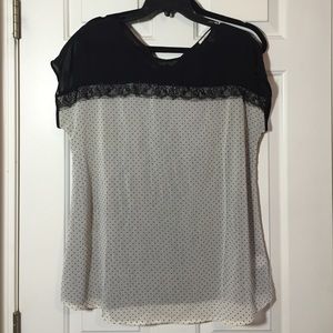 Black and white polka dot shirt.