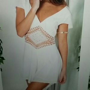 White, cut-out front and deep v back romper