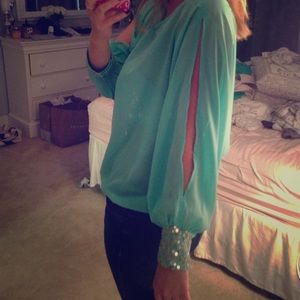Sheer mint green top with cut out long sleeves