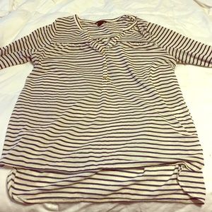 Three quarter length navy and white stripped shirt