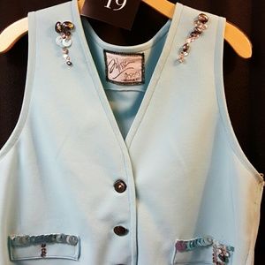 Light blue vest with details size large