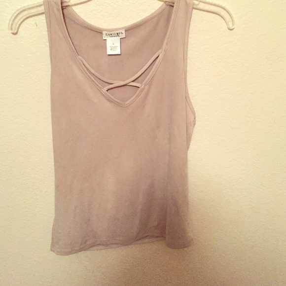 Nude colored top.