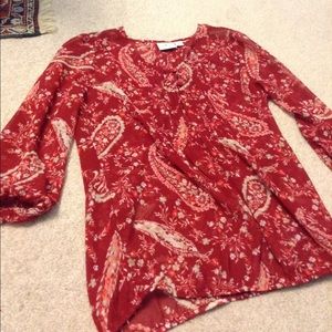 A sheer red paisley shirt