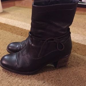 Dark brown leather boots.