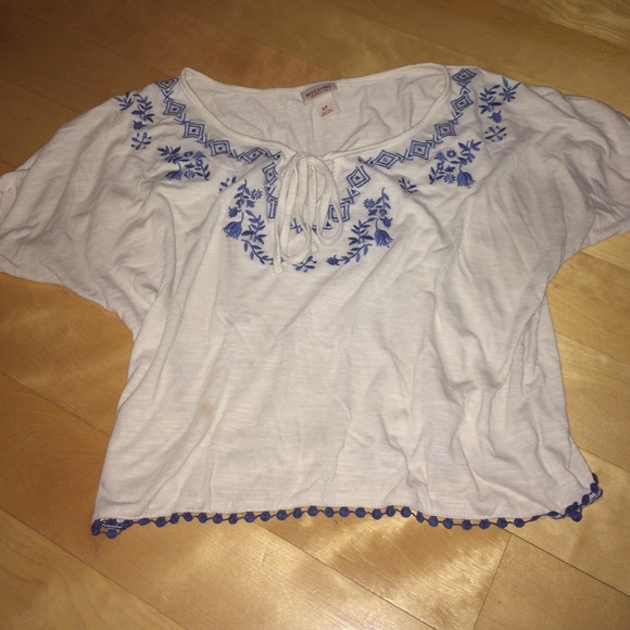White shirt with embroidered blue pattern