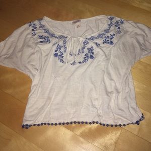 White shirt with embroidered blue pattern