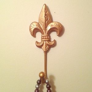 Gold fleur de lis necklace holder