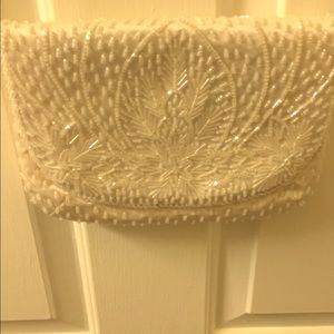 Small white beaded clutch bag with shoulder strap
