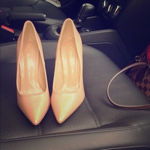 Nude patent pumps