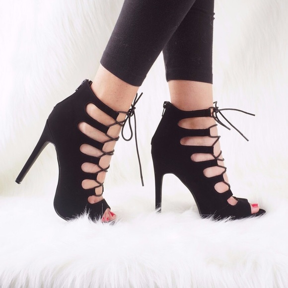 Black lace up heels with zipper on back. Worn once