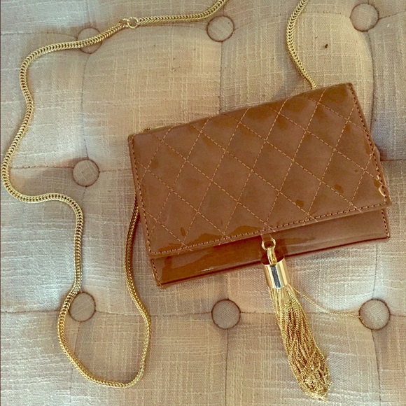 Elegant-chic Big Buddha Tassel Clutch.