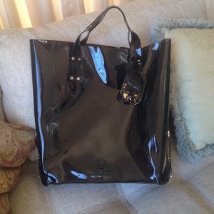 Black plastic bag. Alexander Mqueen.