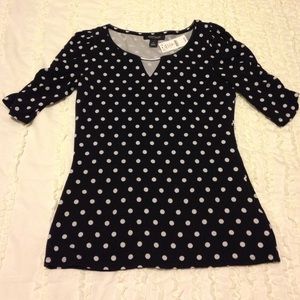 Black & white polka dotted blouse w/ metal detail.