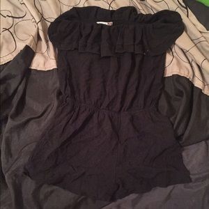 Black romper with subtle ruffle