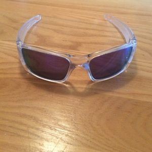 Clear and purple Oakley sun glasses