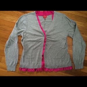 Gray cardigan with pink ruffle