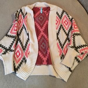 Dolman sleeve shrug sweater.