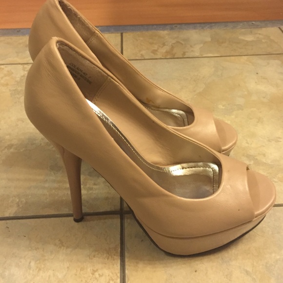 Nude peep toe heels.