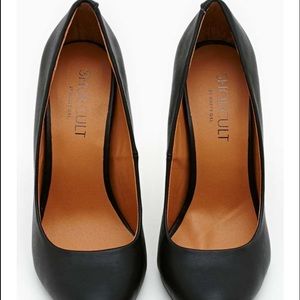 Never worn black vegan leather pumps. By shoe cult