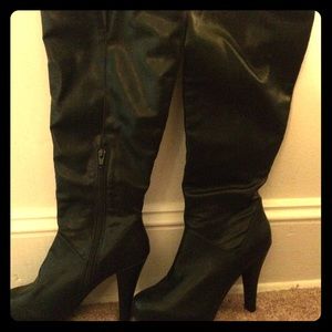 Never worn, black leather boot