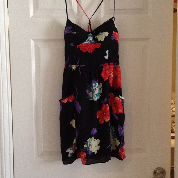 Black floral dress, with pockets.