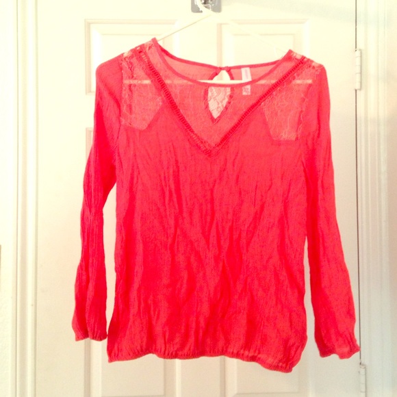 Cute Coral top with lace detail. Slightly sheer.