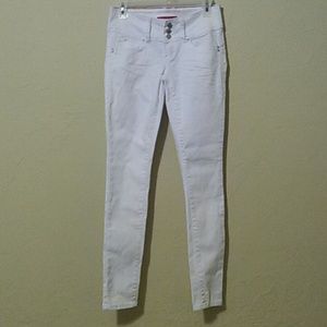 Triple button stretch skinny jeans