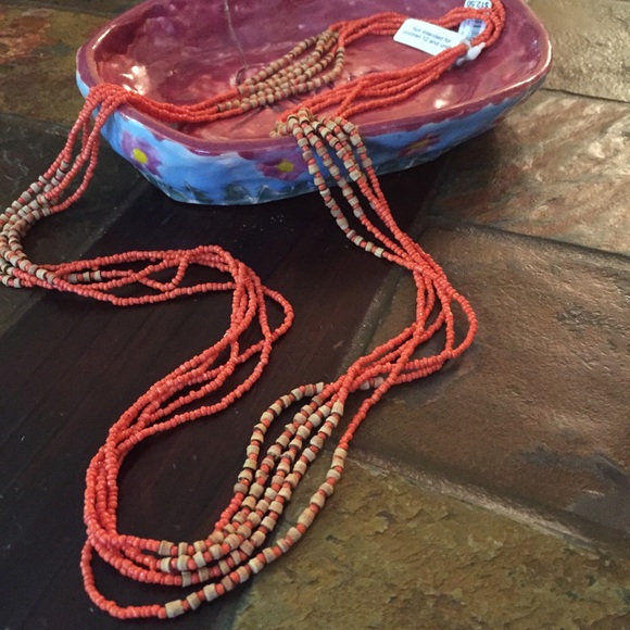 A creative orange and beige beaded necklace