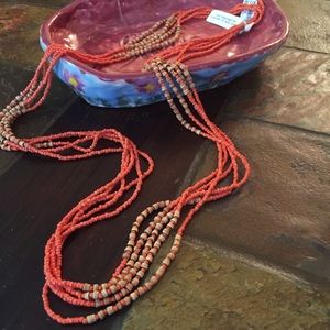 A creative orange and beige beaded necklace
