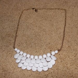 White necklace .
