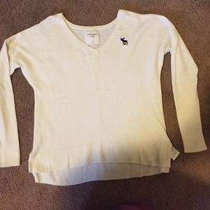 A white Abercrombie and Fitch V-neck sweater