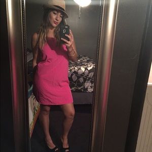 Pink bow back dress.