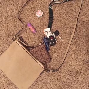 Two zippered tan cross body purse