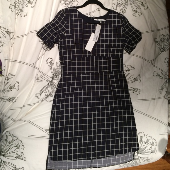 Navy blue dress. Slight high-low cut