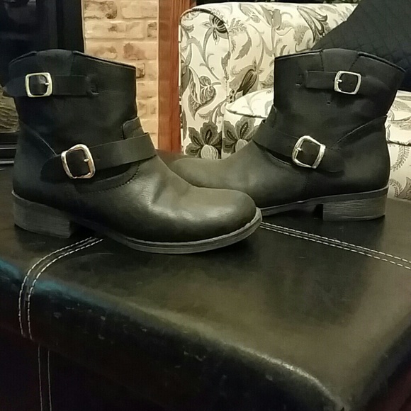 Black ankle boots with gold buckles