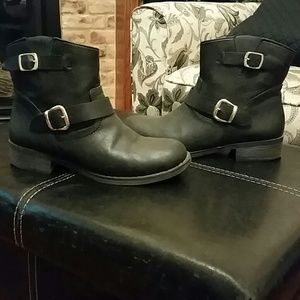 Black ankle boots with gold buckles