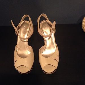 Cream and brown colored heels