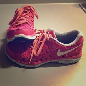 Pink Nike Dual Fusion running shoes