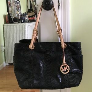 Black "snake skin like " MK bag. NEW CONDITION