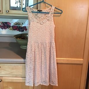 A lacy, light pink dress.