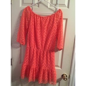 Peach colored dress.