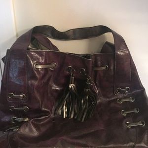 Cute purple tote leather with fringe!