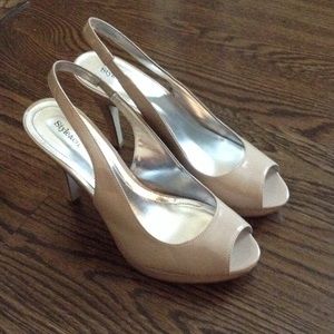 Tan patent- leather sling-back heels with peep toe