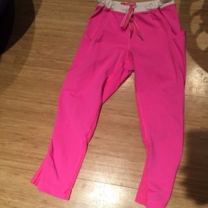 Neon pink Lululemon running pants