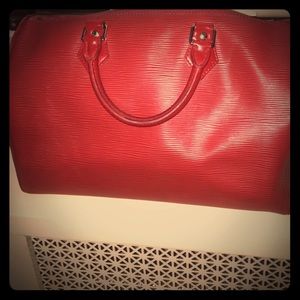 Classic authentic red Louis Vuitton epi speedy.