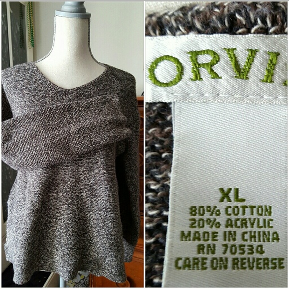 V-neck, Tunic-style sweater.