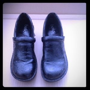 Black embossed clogs