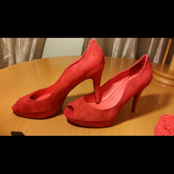 Red suede and leather peep toe .